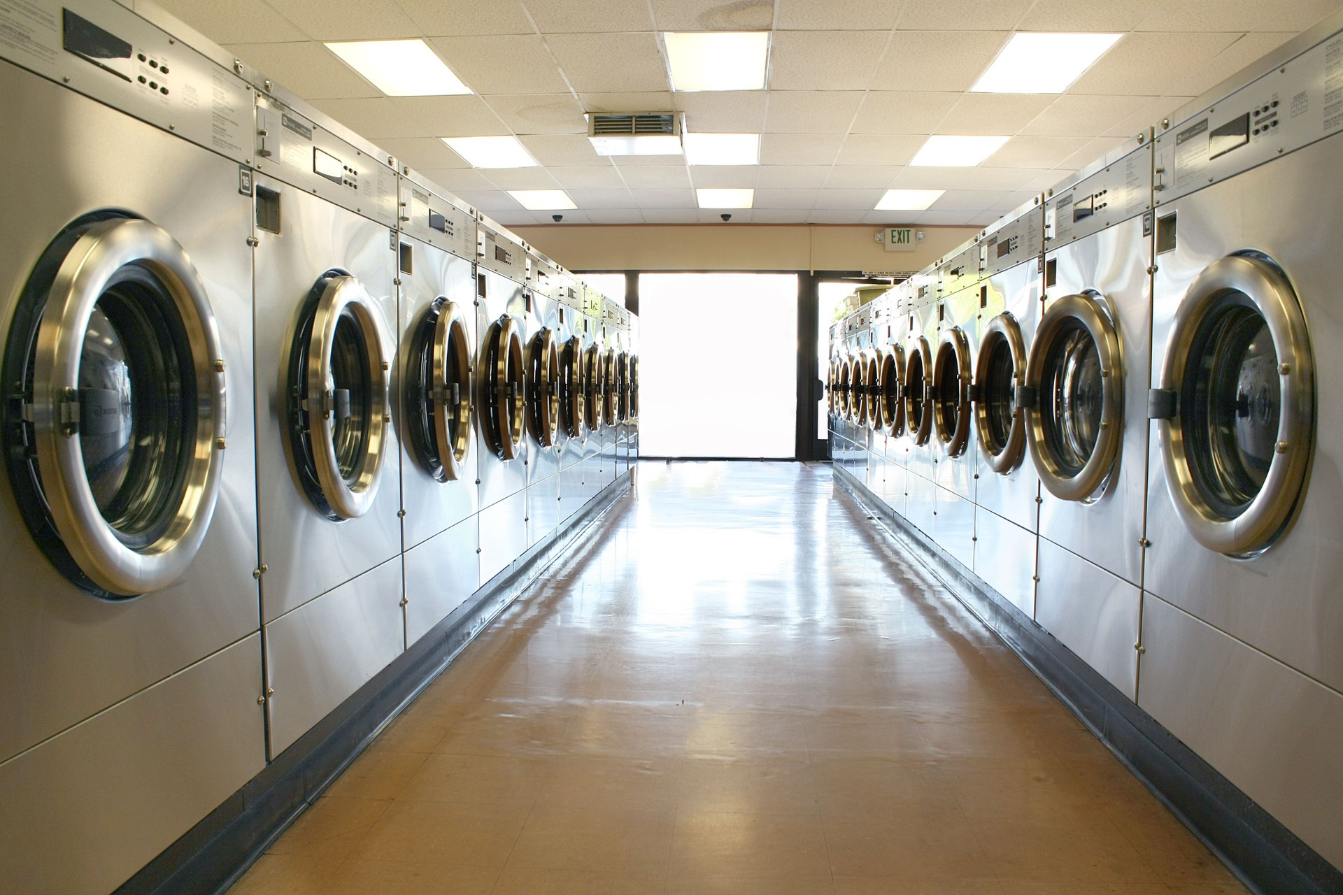An empty laundry shop with the lights on 
